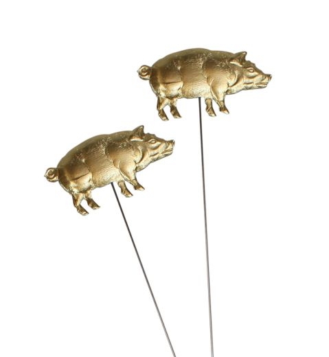 Sticks with golden lucky pigs